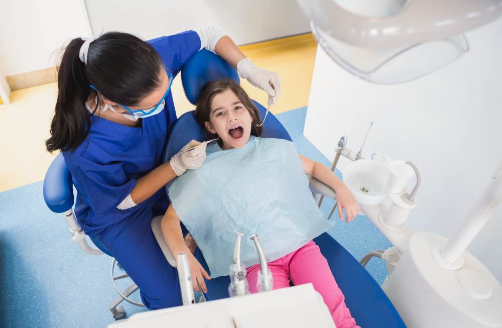 A dentist treating a children