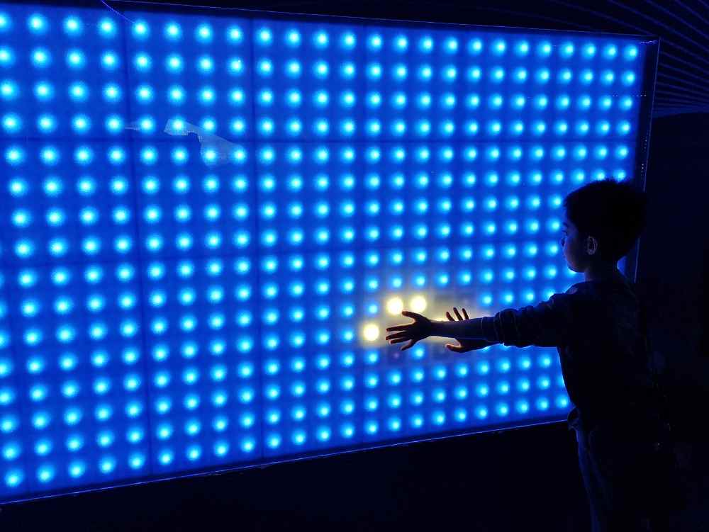 A boy is playing with LED Screen (illustration)